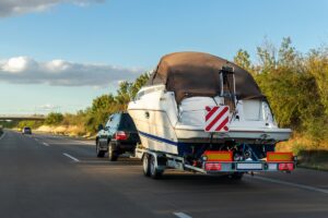 car towing a boat showing boat transportation services